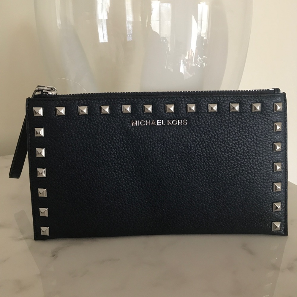 Micheal Kors Navy wristlet with silver studs